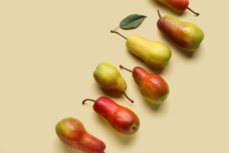 Ripe pears on yellow backgroundの写真素材