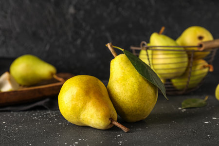 Ripe pears on black backgroundの写真素材