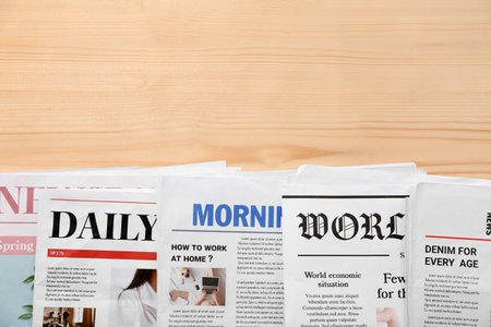 Morning newspapers on wooden backgroundの写真素材