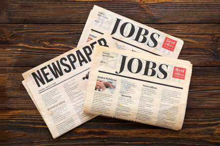 Morning newspapers on wooden backgroundの写真素材