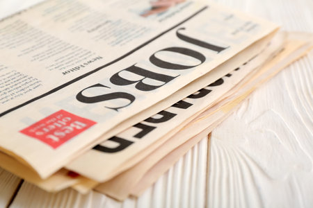 Morning newspapers on white wooden background