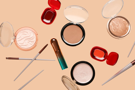 Flying decorative cosmetics on pale orange backgroundの写真素材