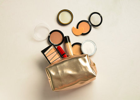 Bag with decorative cosmetic products on beige backgroundの写真素材