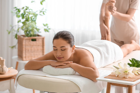 Young woman having massage in spa salonの写真素材