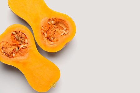 Halves of fresh pumpkin on white backgroundの写真素材