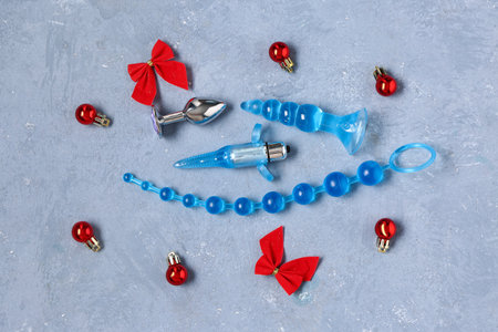 Composition with different sex toys and Christmas decorations on color backgroundの写真素材