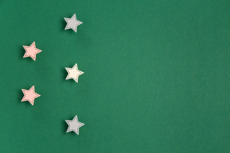 Five stars rating on green background. Customer experience concept