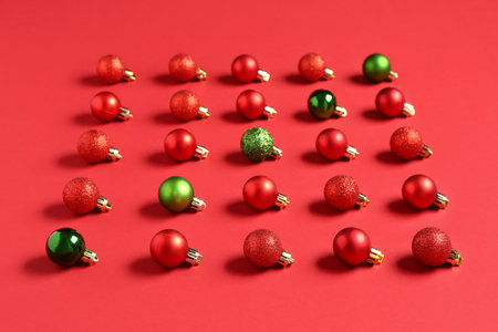 Composition with different Christmas balls on red backgroundの写真素材