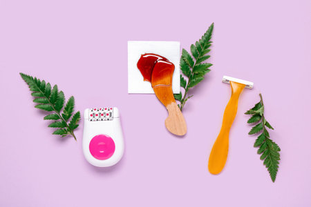 Different supplies for hair removal with brush and plant leaves on purple background