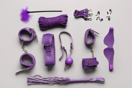 Different purple sex toys on gray backgroundの写真素材