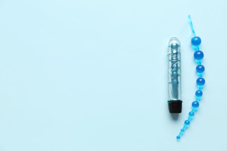 Anal plug and vibrator from sex shop on blue backgroundの写真素材