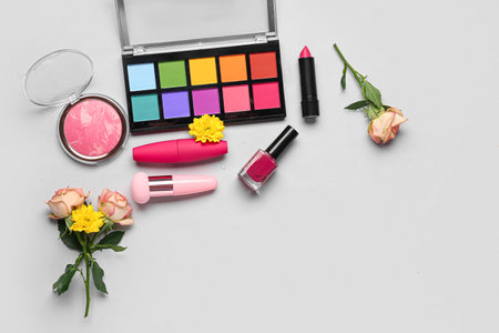 Composition with makeup products and beautiful chrysanthemum flowers on white backgroundの写真素材