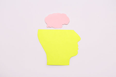 Paper human head with brain on gray background. Mental Health Dayの写真素材