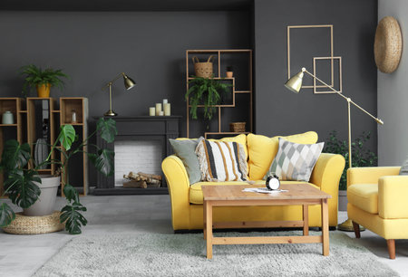 Interior of living room with decorative mantelpiece and sofa