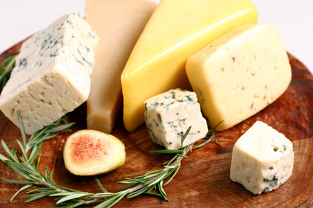 Tasty cheese with fig and rosemary on plateの写真素材