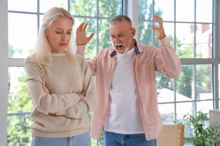 Mature couple quarrelling at home. Divorce conceptの写真素材