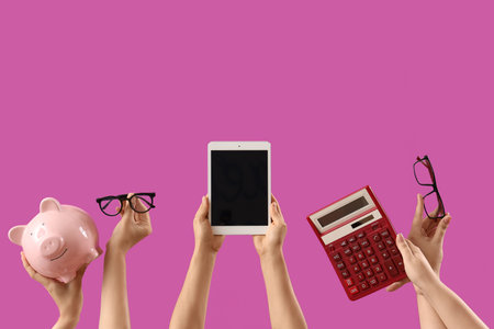 Women with blank tablet computer, piggy bank, calculator and eyeglasses on purple background