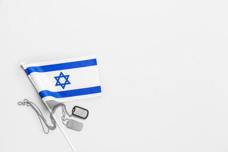 Flag of Israel with dog tags on white backgroundの写真素材