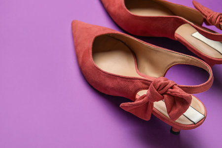 Stylish pink shoes on purple backgroundの写真素材