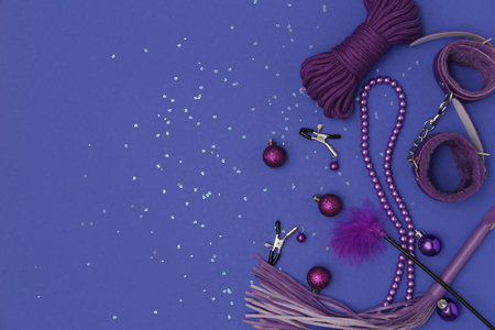 Sex toys with Christmas balls on violet backgroundの写真素材