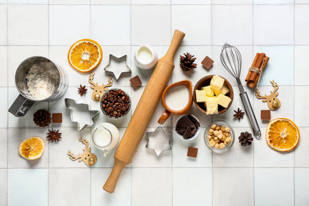 Different ingredients for preparing Christmas pie on white tile backgroundの写真素材