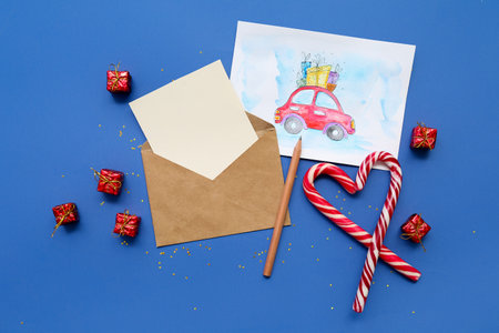 Beautiful composition with Christmas cards on blue backgroundの写真素材