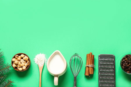 Beautiful composition with different ingredients for preparing Christmas pie on green backgroundの写真素材