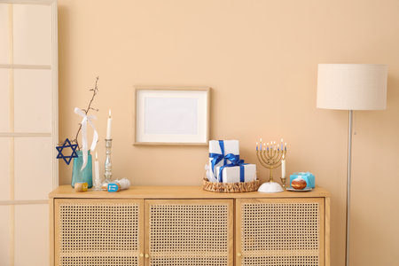Wooden cabinet with decorations for Hanukkah celebration in living roomの写真素材