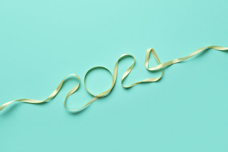 Figure 2024 made of ribbon on color backgroundの写真素材