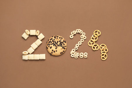 Figure 2024 made of cereals and cookies on color backgroundの写真素材