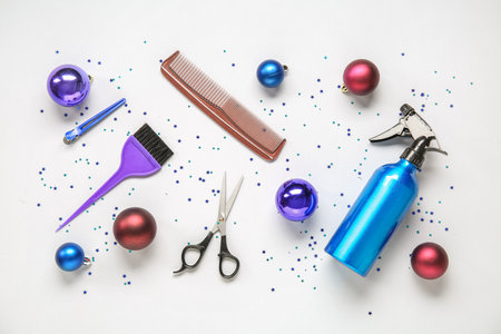 Composition with hairdresser's accessories and Christmas decorations on light backgroundの写真素材