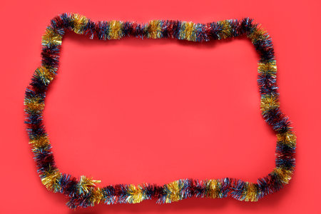 Frame made of tinsel on red backgroundの写真素材
