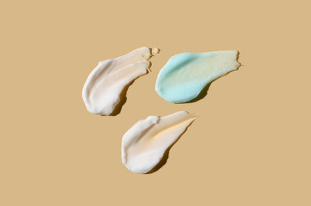 Samples of natural cream on color backgroundの写真素材