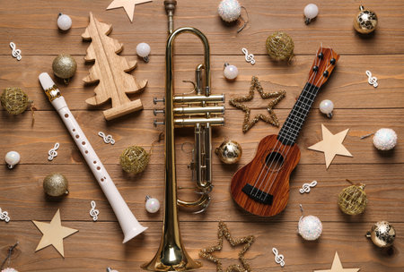 Composition with musical instruments and beautiful Christmas decorations on wooden backgroundの写真素材