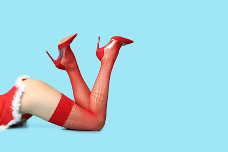 Beautiful young sexy woman in lingerie on blue background, closeupの写真素材