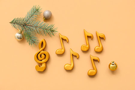 Music notes with Christmas decor on orange backgroundの写真素材