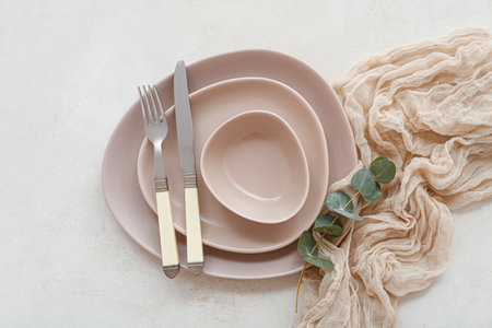 Stylish table setting on white backgroundの写真素材
