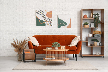 Interior of stylish living room with red sofa and table