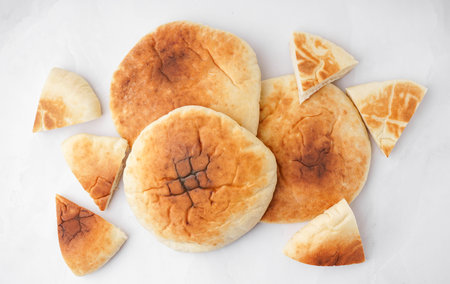 Tasty pita bread on white background