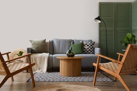 Interior of modern living room with gray sofa, armchairs and coffee tableの写真素材