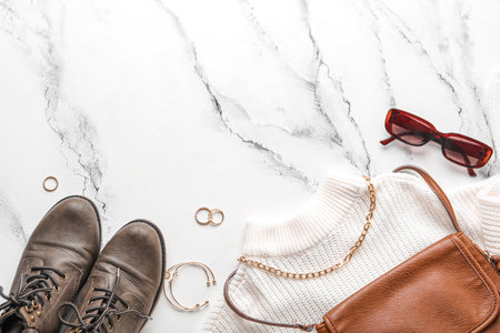 Composition with stylish female accessories, clothes and shoes on light backgroundの写真素材