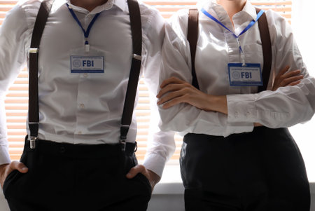 FBI agents near window in room, closeupの写真素材