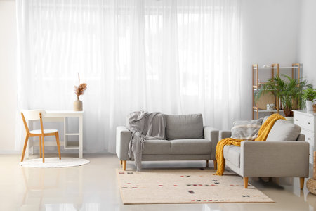 Interior of modern living room with gray sofas