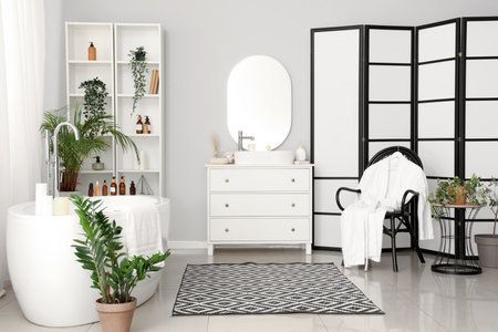 Interior of bathroom with bathtub and accessoriesの写真素材