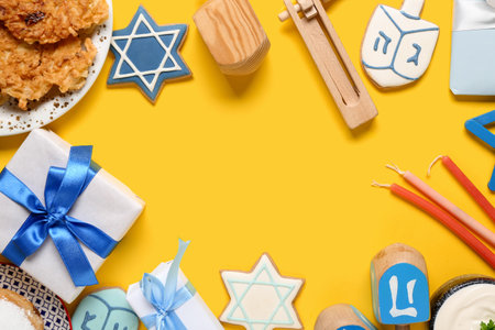 Frame made from different Hannukah symbols on yellow backgroundの写真素材