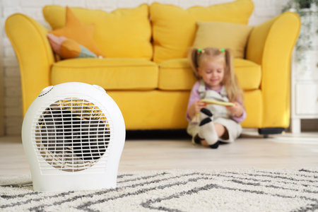 Electric fan heater in children's room, closeupの写真素材