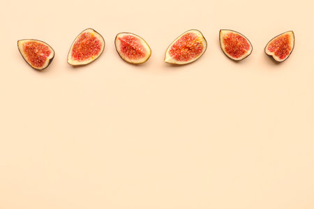 Pieces of fresh ripe figs on orange backgroundの写真素材