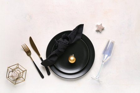 Beautiful table setting with Christmas ball and candle on white backgroundの写真素材