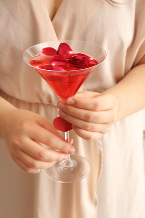 Woman holding glass of cocktail tasty. Valentine's Day celebrationの写真素材