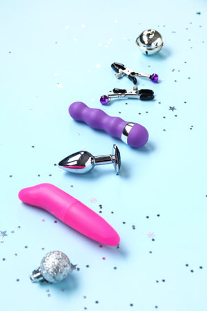 Set of sex toys and Christmas decorations on color backgroundの写真素材